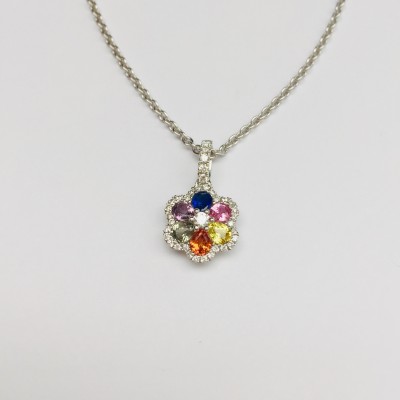 Pendentif fleur serti de saphirs multicolores et de brillants. Pendentif fleur serti de saphirs multicolores et de brillants.